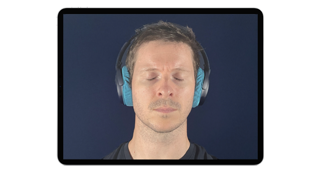 Client wearing headphones listening to auditory bilateral stimulation during emdr therapy