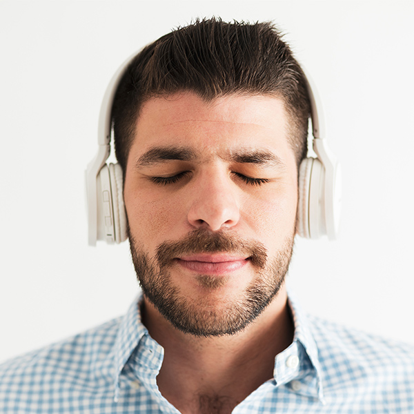 Client with eyes closed listening to auditory bilateral stimulation.