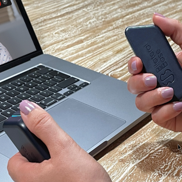 client holding tactile units for bilateral stimulation during EMDR therapy